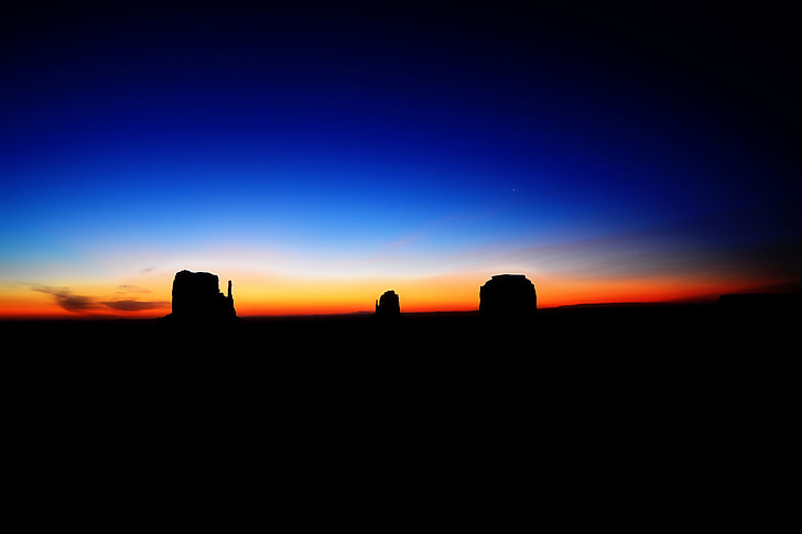 silhouette of rocks after sunset