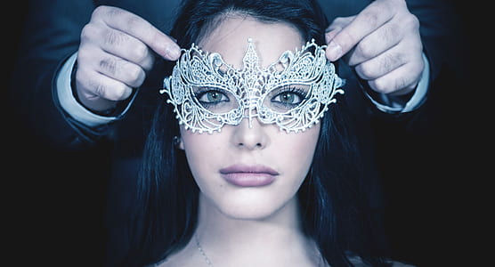woman wearing white lace masquerade