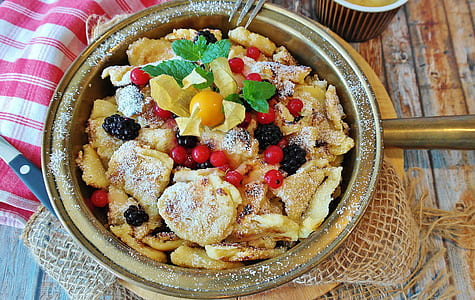 bowl of mixed fruits and pastry