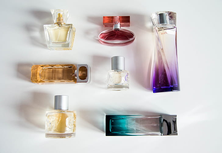 flat-lay photography of fragrance bottle lot