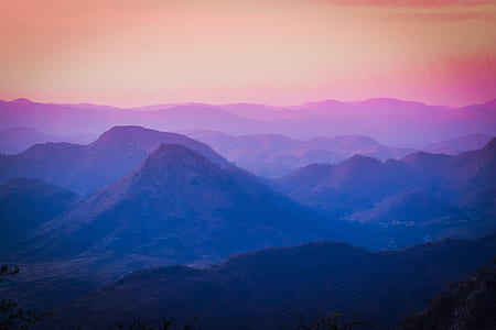 purple and pink mountains digital wallpaper