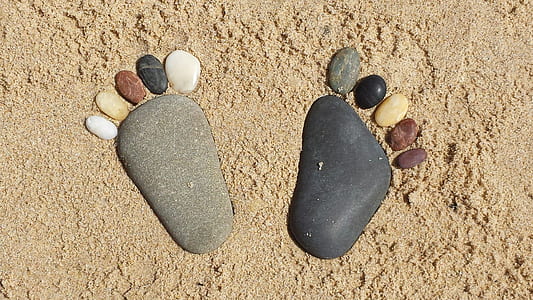 multicolored feet-shaped marble stones
