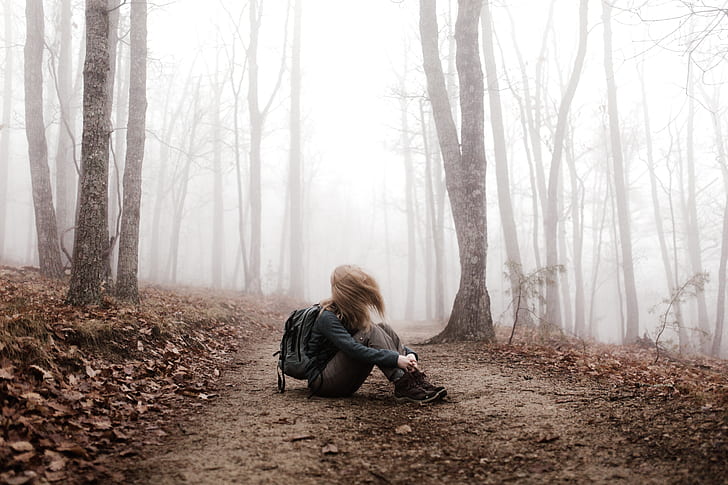 woman in the middle of forest during daytime