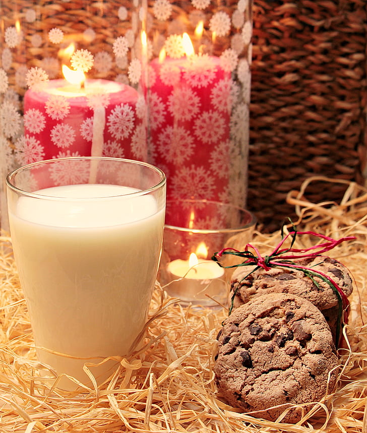 cookies beside cup and candles