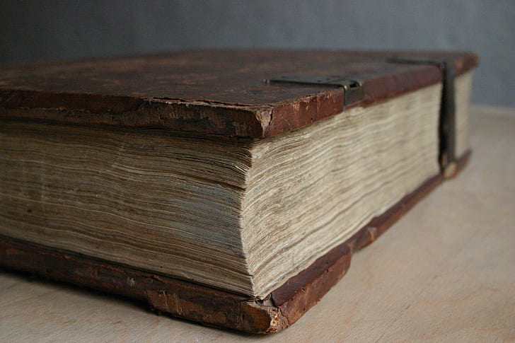 brown book on brown wooden table
