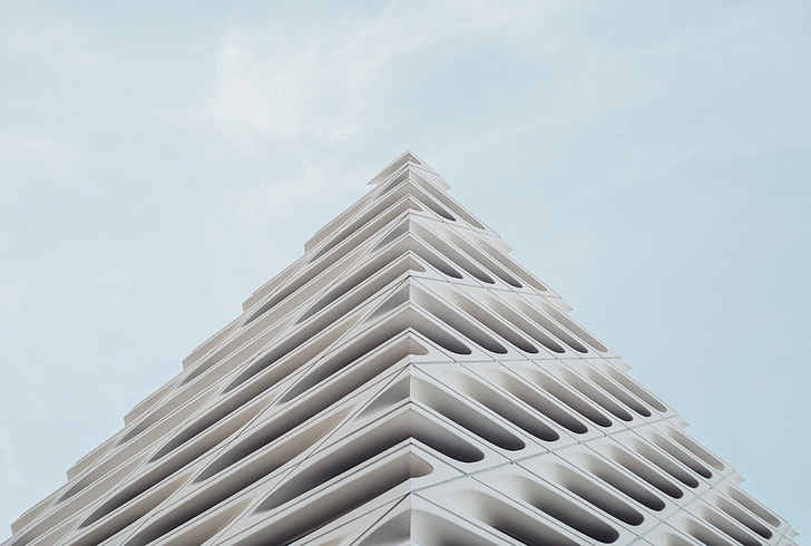 white concrete building in low angle photography