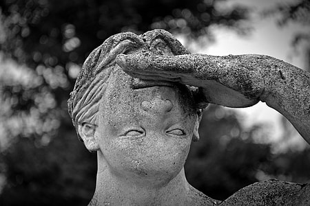grayscale photography of edited statue