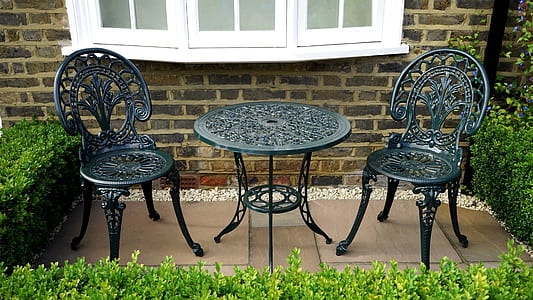 three-piece black metal patio table and chair set