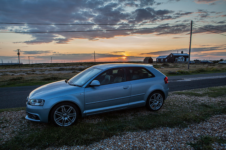 An Audi A3 S-Line sits at sunset on the Kent Coast in the South of England. 