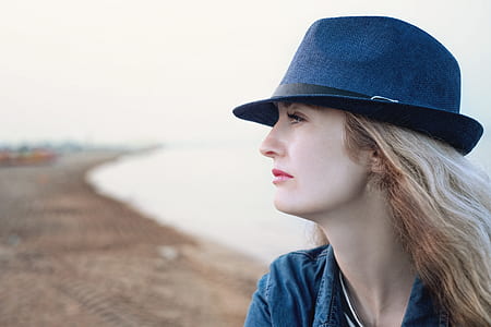 portrait photography of woman in black fedora hat posing for photo