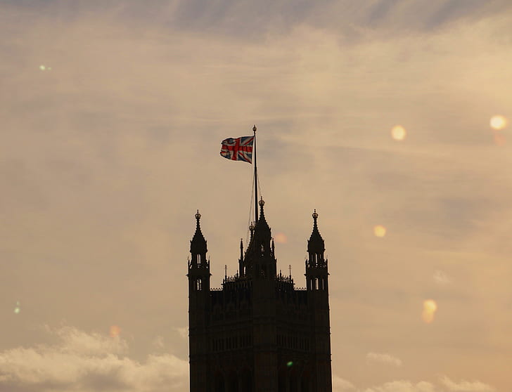 silhouette of tower with United Kingdom flag
