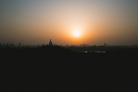 silhouette photography of city during sunset