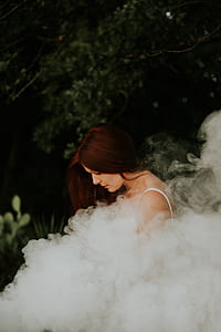woman in white shirt with smoke