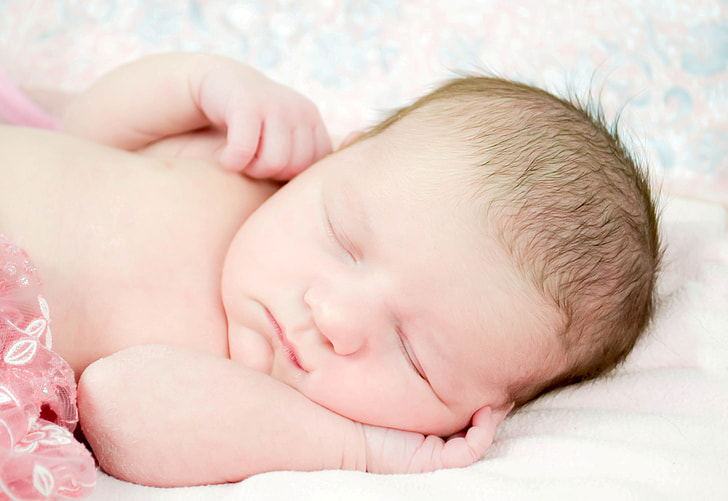 sleeping baby in close-up photography