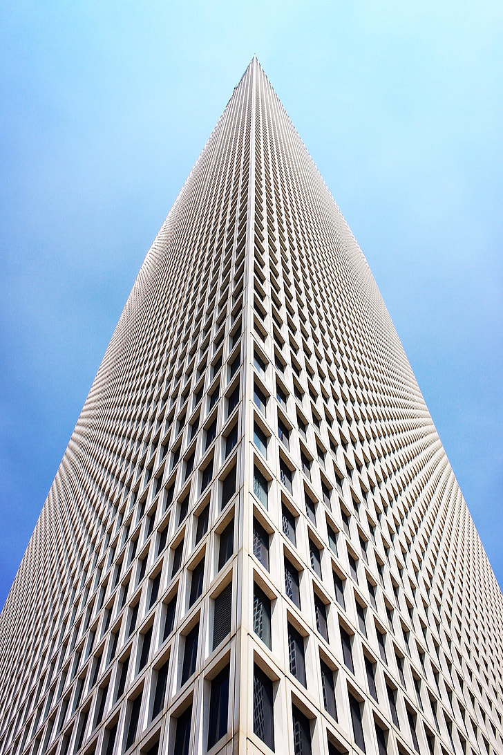 low angle photo of beige high-rise building