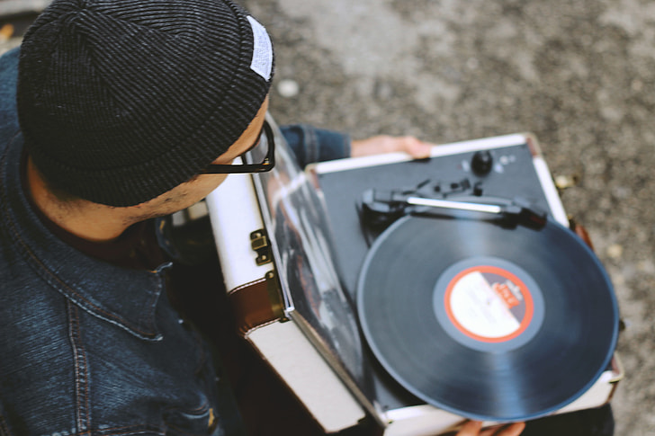 Man with a vinyl record player