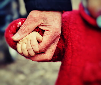 selective photography of person holding hands