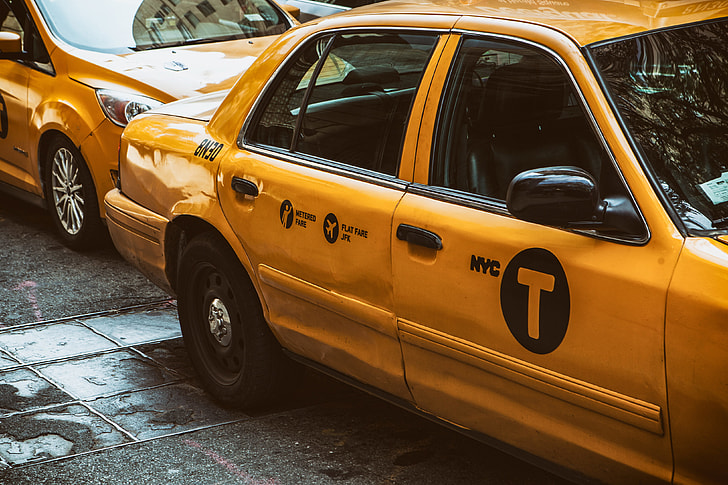 A shot of a classic yellow New York Taxi, image captured in Manhattan, NYC with a Canon 5D