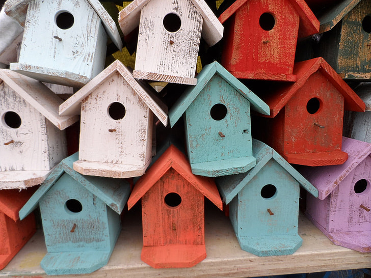 wooden birdhouse lot during daytime