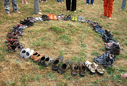 assorted footwear lot on field