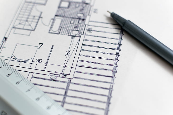 black ballpoint pen on house blueprint