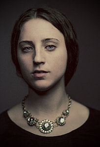 portrait of woman wearing necklace