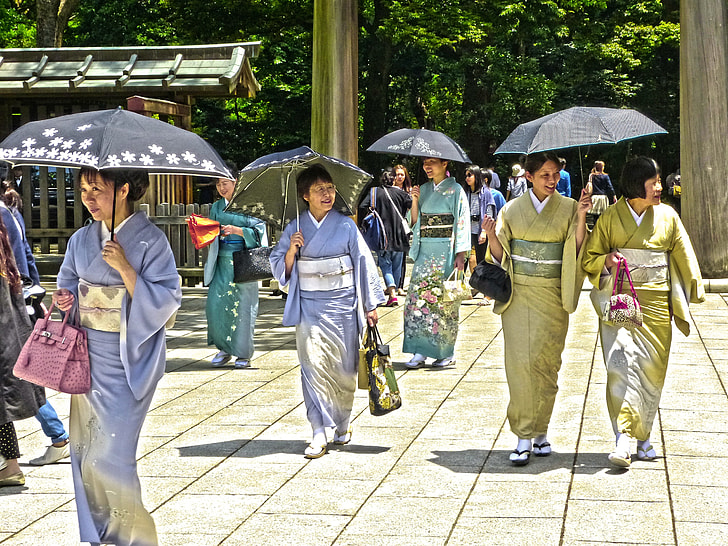 geisha women with umbrellas