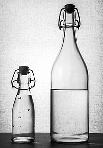 two clear glass bottles