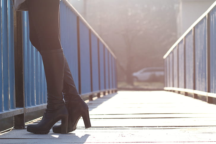 Woman Standing on Bridge