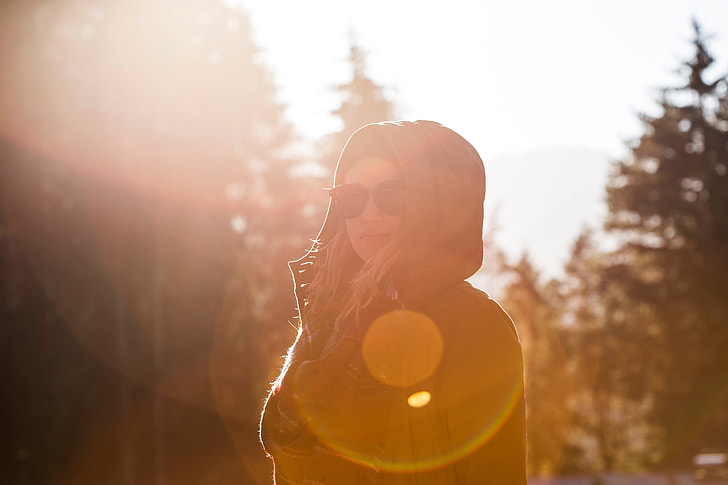 woman wearing brown hoodie during sunshine