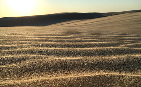 gray desert sand at daytime