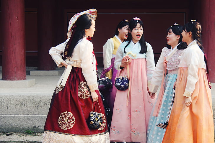 group of women wearing traditional dresses