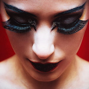 woman with black false eyelashes