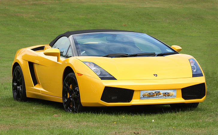 photograph of yellow sports car