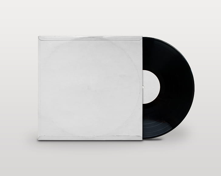 Royalty-Free photo: Black vinyl record with white sleeve | PickPik