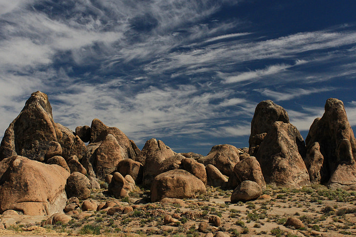brown rock formation under blue sky at daytime