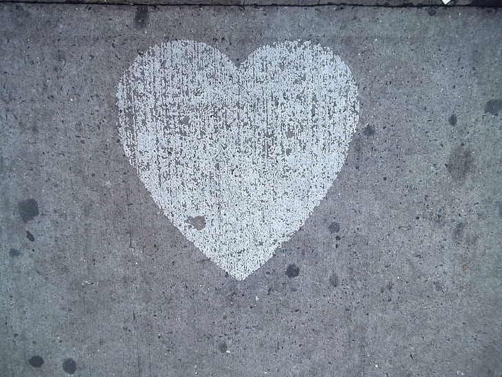 gray and white heart graffiti in wall