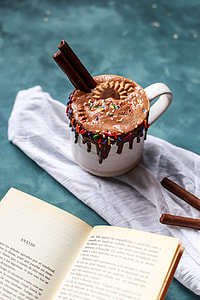 chocolate stick hot chocolate with sprinkles in cup