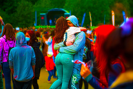 photography of man and woman huggin opn park