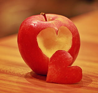 red apple with heart cut