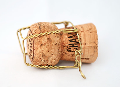 brown bottle cork lid on white surface