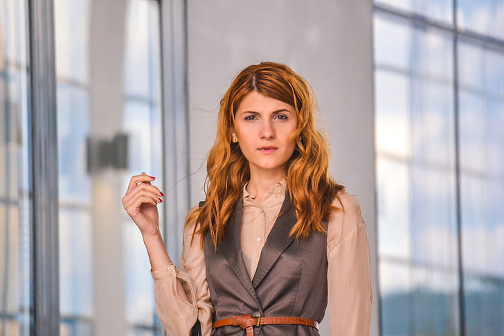 selective focus photography of woman wearing brown and gray collared button-up top