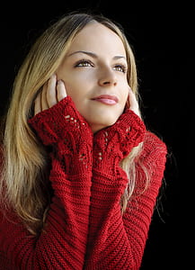 selective focus photography of woman in red knitted sweater