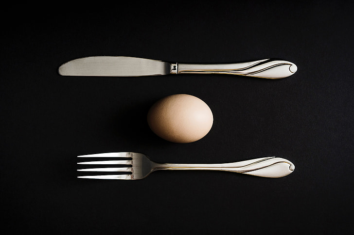 Overhead shot of egg and knife and fork