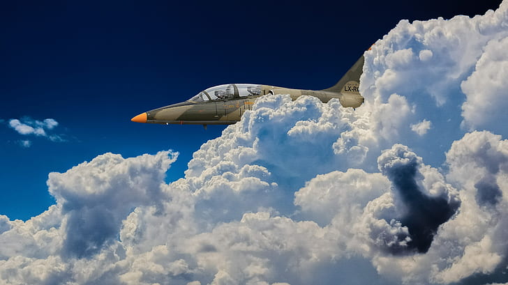 close-up photo of aircraft near clouds