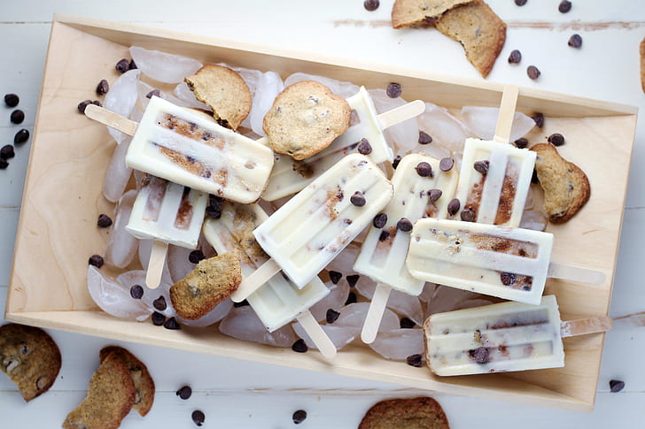 sliced breads and ice cream on brown wooden food tray