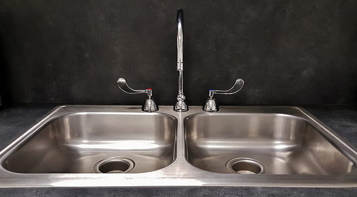 silver double sink with gooseneck faucet