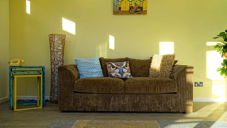 brown fabric 2-seat sofa near brown wicker decor