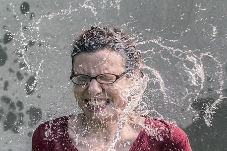 woman splashed by water