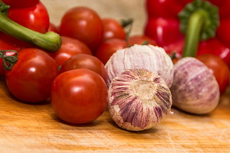 selective focus photography of tomatoes and onions